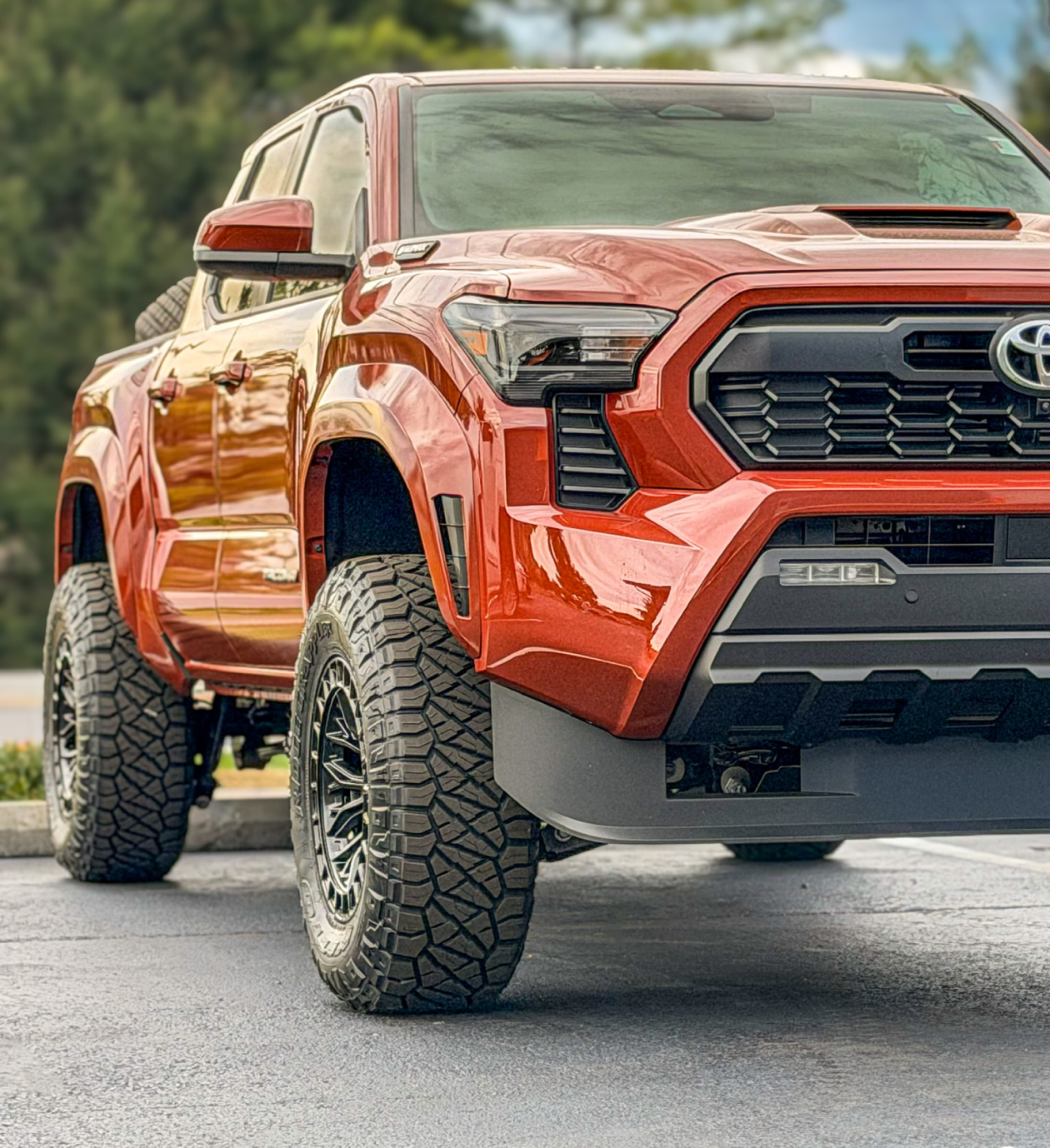 Red pickup truck parked on asphalt