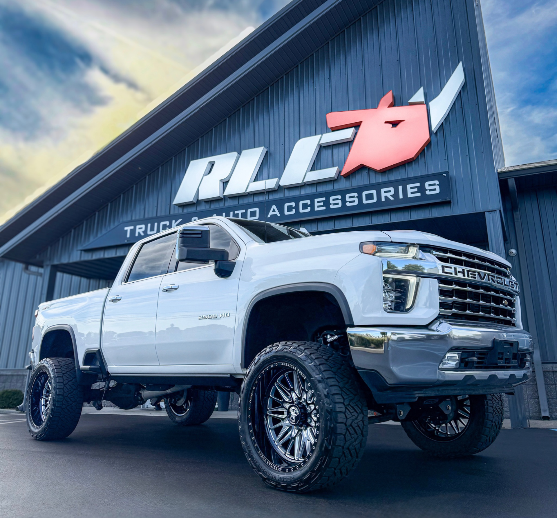 White truck parked at an accessory shop